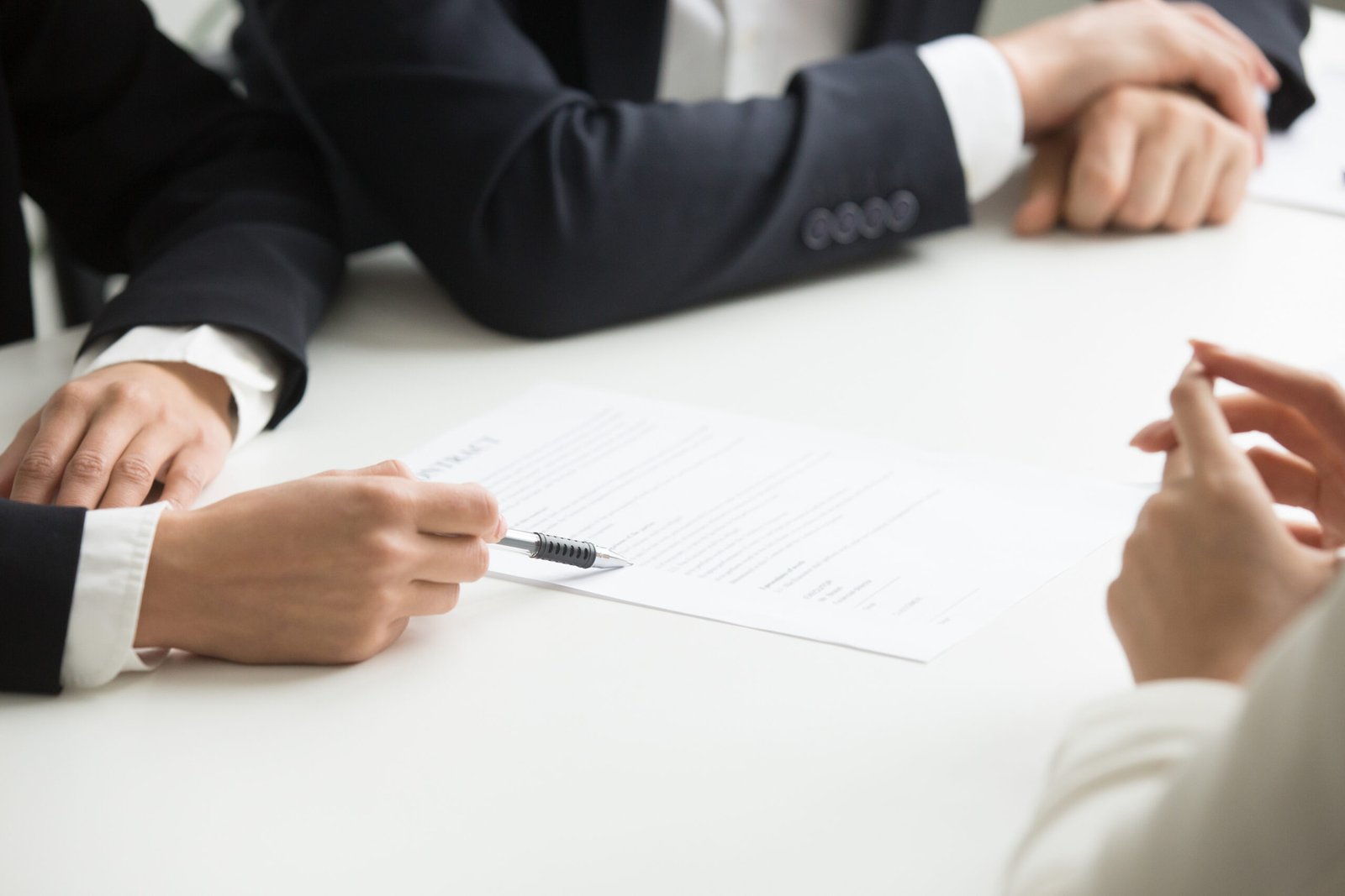 Commercial real estate brokers negotiating a deal, but not thinking about their personal financial planning.